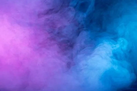 Pattern, Neon pink, blue  and  purple smoke in the  on a dark isolated backgr Stock Photos