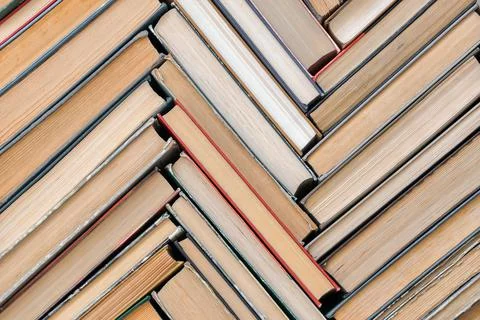 A pattern of old books with a top view. Solid background Stock Photos