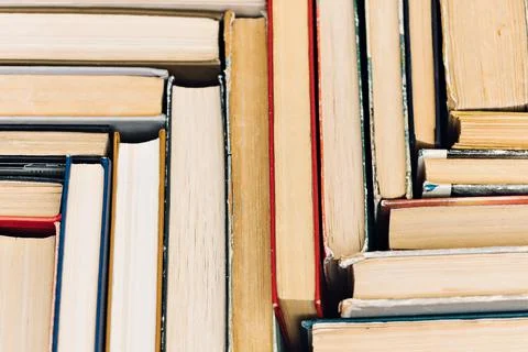 A pattern of old books with a top view. Solid background Stock Photos