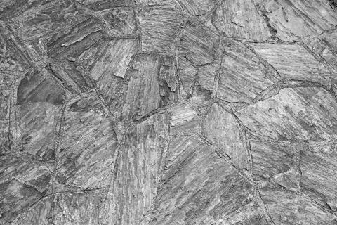 Pattern of old irregular stones gives a harmonic background Stock Photos