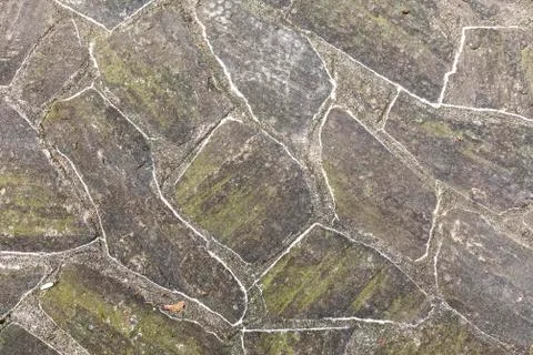 Pattern of old irregular stones gives a harmonic background Stock Photos