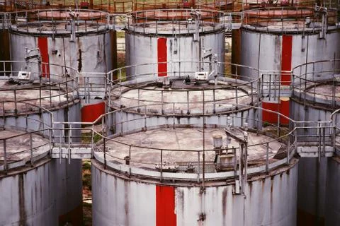 Pattern of old large oil storage tanks Stock Photos