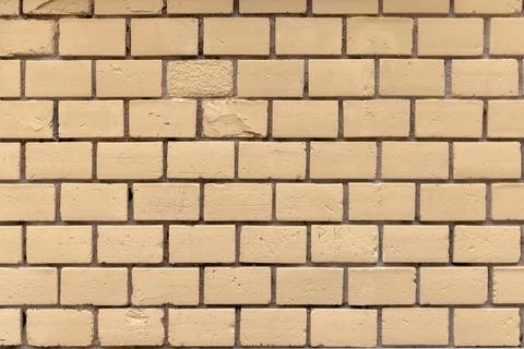Pattern of old yellow brick wall background Stock Photos
