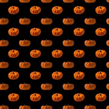 Pattern with orange pumpkins on black background Stock Photos