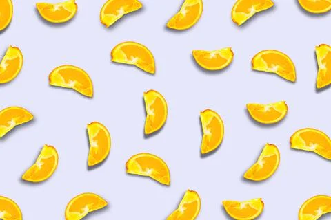 A pattern of orange slices with a shadow. Fruit background. Stock Photos