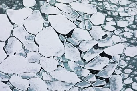 Pattern of pack ice floes on winter ocean surface Stock Photos