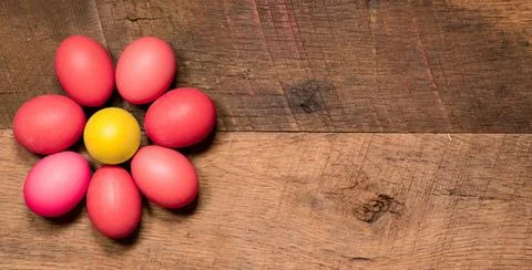 Pattern of painted eggs on wooden table for Easter Easter background with ... Stock Photos