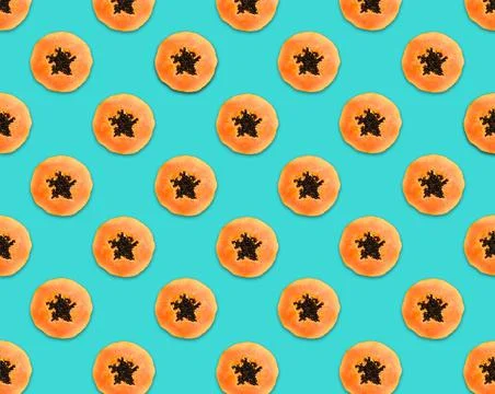 Pattern of papaya slices on turquoise background 写真素材