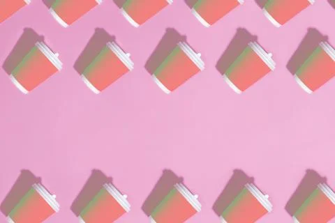 Pattern of paper cups on pink background. Stock Photos