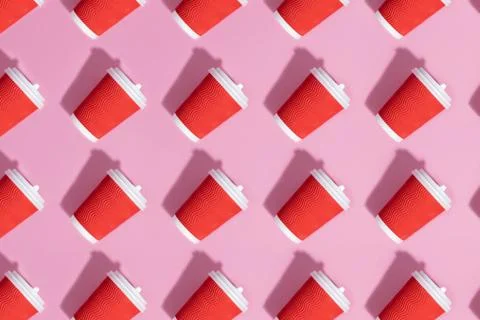 Pattern of paper cups on pink background. Stock Photos