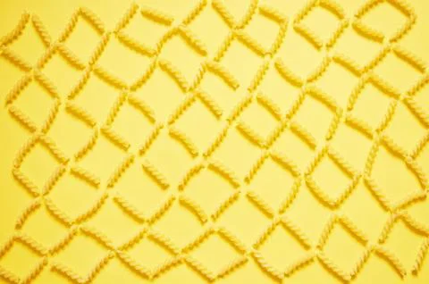 Pattern of pasta on a yellow background. The view from the top. Foto stock