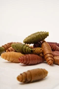 Pattern pastila fruit leather rolls up with fruits on white background. Stock Photos