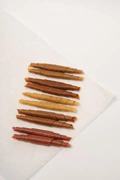 Pattern pastila fruit leather rolls up with fruits on white background.  Stock Photos
