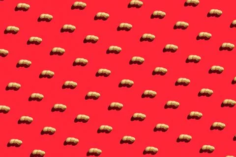 Pattern of peanuts with shell. Fashionable sunny pattern of peanuts with shel Stock Photos
