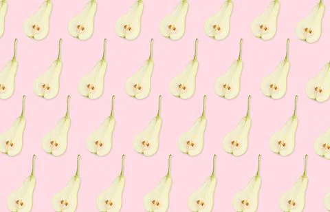 Pattern of pear halves on light pink background Stock Photos