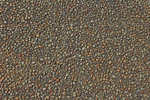 Pattern of pebbles in concrete Stock Photos