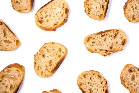 Pattern with pieces of white bread isolated on white background. Stock Photos