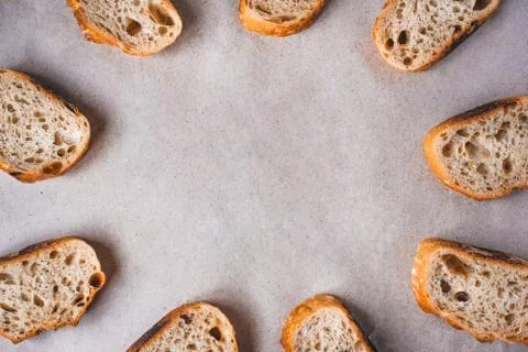 Pattern with pieces of white bread on paper background. Stock Photos