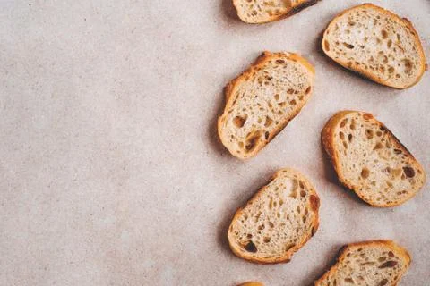 Pattern with pieces of white bread on paper background. Stock Photos
