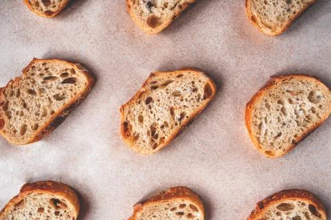 Pattern with pieces of white bread on paper background. Stock Photos