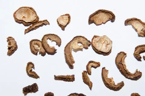 Pattern of a pile of dried apples in slices on a white background. Top view Stock Photos