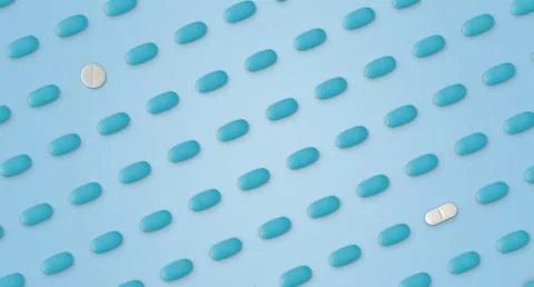 Pattern of pills on a blue background. Many pills on a blue background Stock Photos