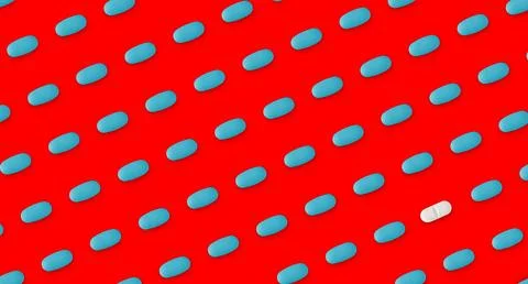 Pattern of pills on a red background. Many pills on a redbackground Stock Photos