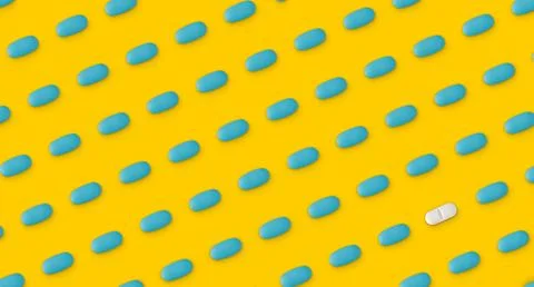 Pattern of pills on a yellow background. Many pills on a yellow background Stock Photos
