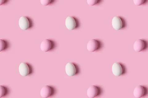 Pattern of pink and white Easter eggs over pink background 스톡 사진
