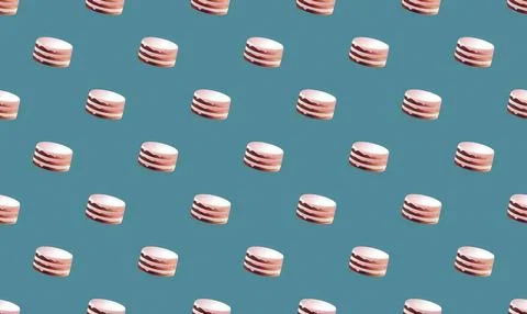 Pattern of pink and white macarons on blue background Stock Illustration