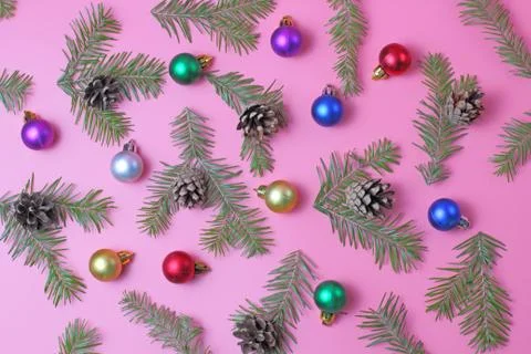 Pattern on a pink background with Christmas or New Year fir branches and colo Stock Photos
