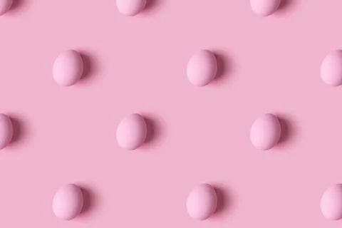 Pattern of pink Easter eggs over pink background Stock Photos