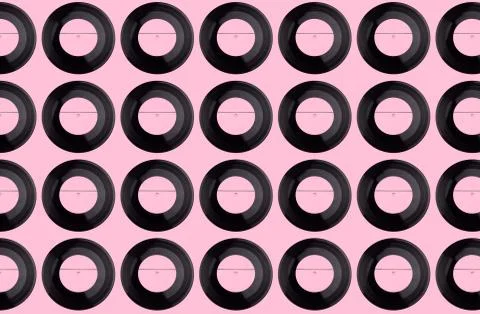Pattern of pink vinyl discs on a pink background Stock Photos