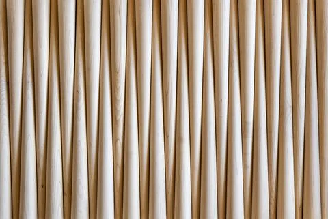 Pattern of polished conical wooden table legs as background Foto stock