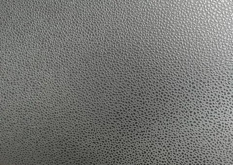 Pattern polka dots on artificial leather surface. There is light shining fr.. Stock Photos