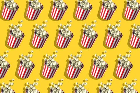 Pattern of popcorn retro boxes on yellow background. Harsh shadow. Cinema Stock Illustration