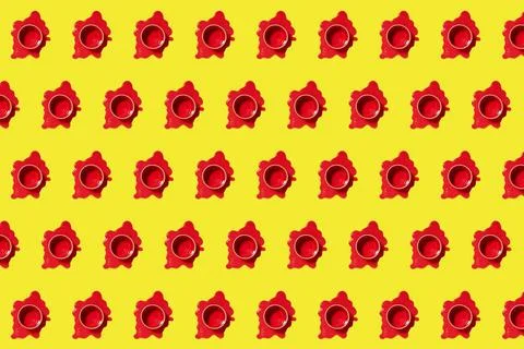 Pattern from puddles of spilled red paint and cans in them. Creative horiz... Stock Photos