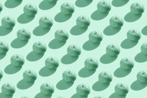 Pattern of pumpkins on mint color background. Stock Photos