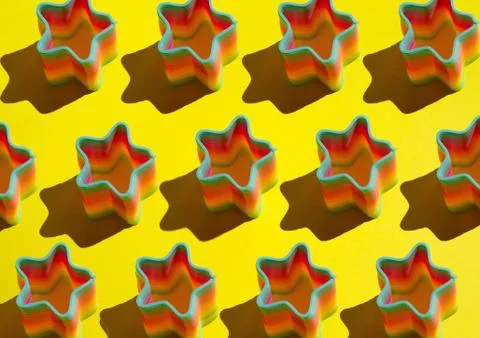 Pattern of ranbow toy on bright yellow background Stock Photos