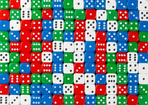 Pattern of random ordered red, white , green and blue dices Stock Photos