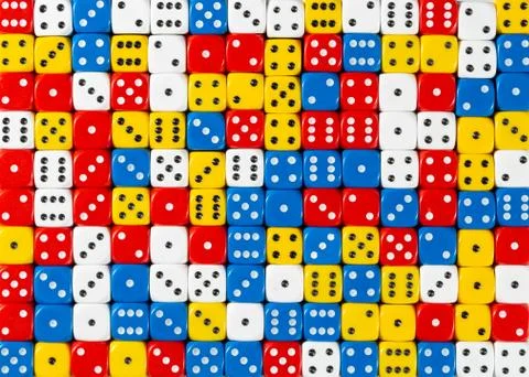 Pattern of random ordered red, white, yellow and blue dices Stock Photos