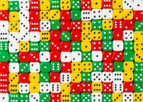 Pattern of random ordered red, white, yellow and green dices Stock Photos