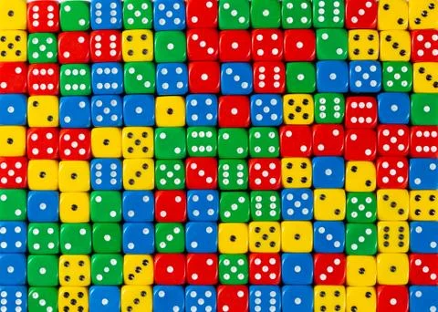 Pattern of random ordered red, yellow, green and blue dices Stock Photos