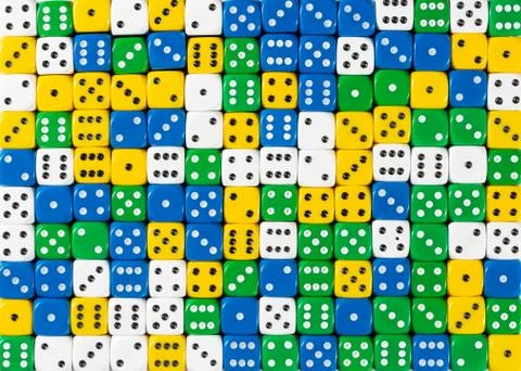 Pattern of random ordered white, yellow, green and blue dices Stock Photos