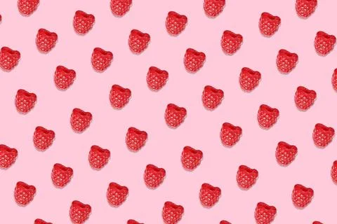 Pattern of raspberries on pale pink background Stock Photos