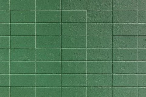 Pattern of Rectangular Ceramic Wall Tiles Painted Solid Green for Texture Stock Photos