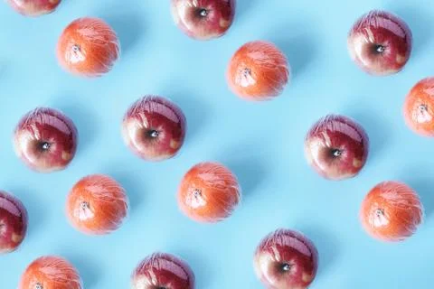 Pattern of recycling and environment concept: fresh red apple and orange in p Stock Photos