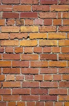 Pattern of red and brown bricks Stock Photos