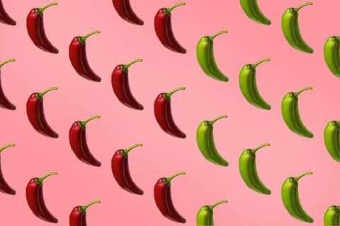 Pattern of red and green peppers isolated on pink background. Stock Photos