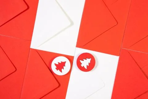 Pattern from red and white envelopes with red and white wooden trees. 库存照片